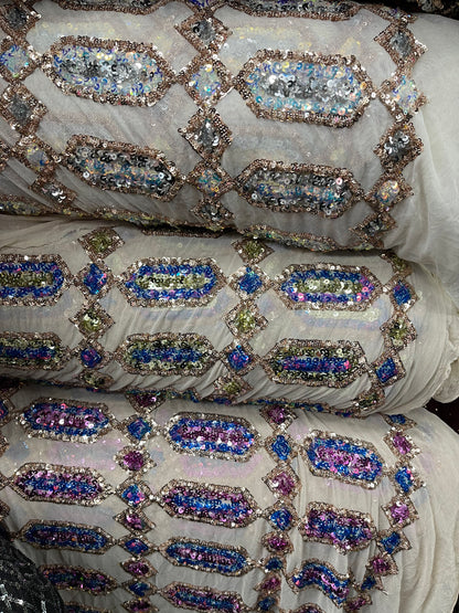 Elegant geometric design iridescent sequins embroidered on stretch mesh 4-way 50/52” Sold by the YD. Ships Worldwide from Los Angeles cali