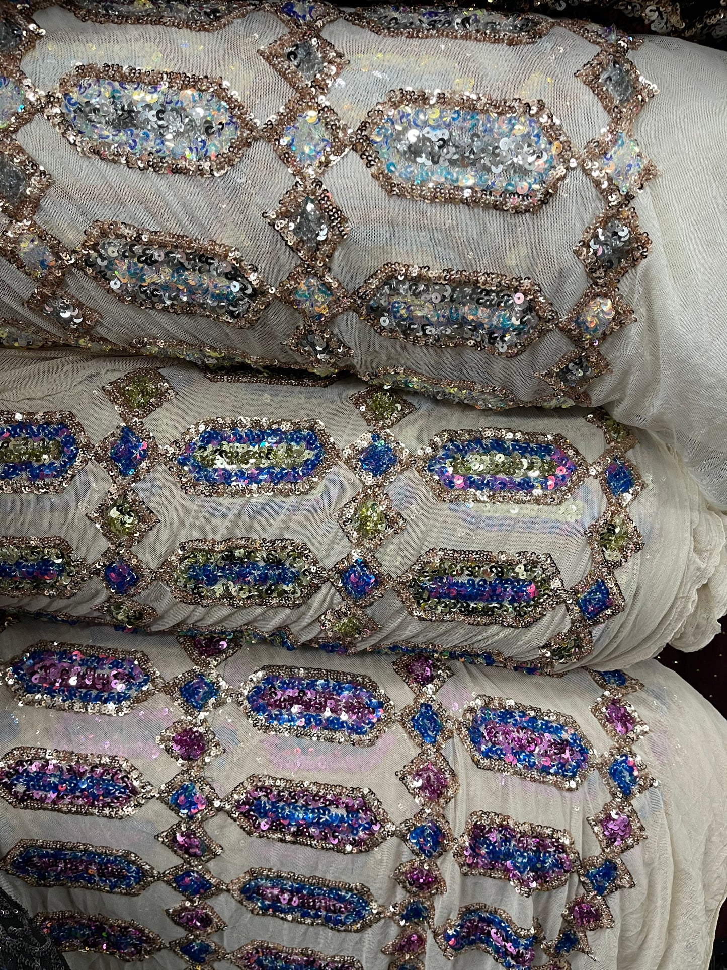 Elegant geometric design iridescent sequins embroidered on stretch mesh 4-way 50/52” Sold by the YD. Ships Worldwide from Los Angeles cali