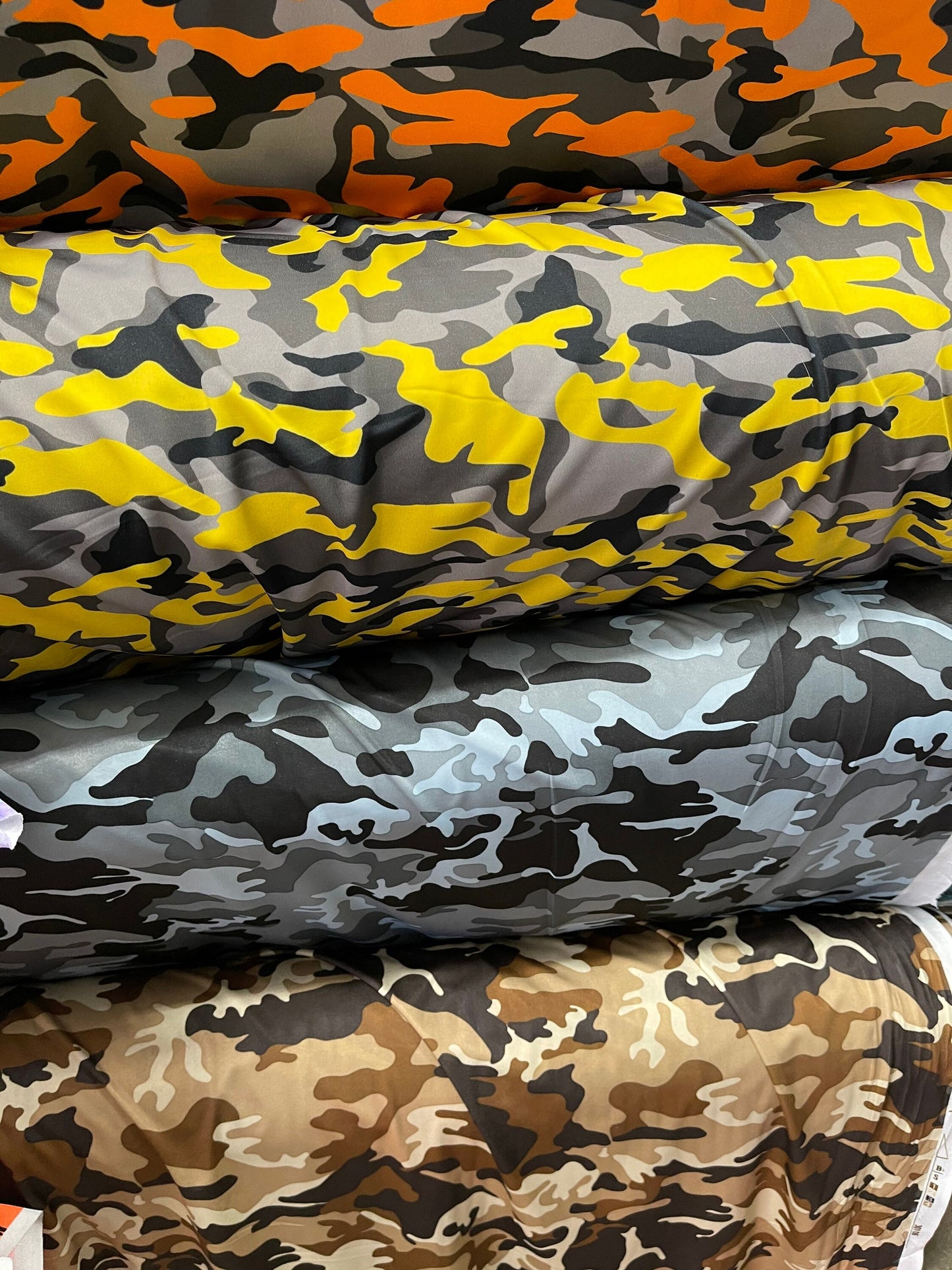 Camouflage design print on nylon spandex 4-way stretch 58/60” Sold by the YD. Ships Worldwide from Los Angeles California USA.