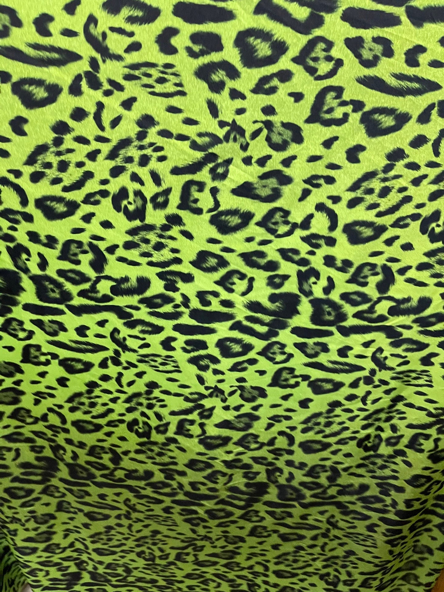 Exotic leopard design print on nylon spandex 4-way stretch Green /black 58/60” Sold by the YD. Ships Worldwide from Los Angeles California