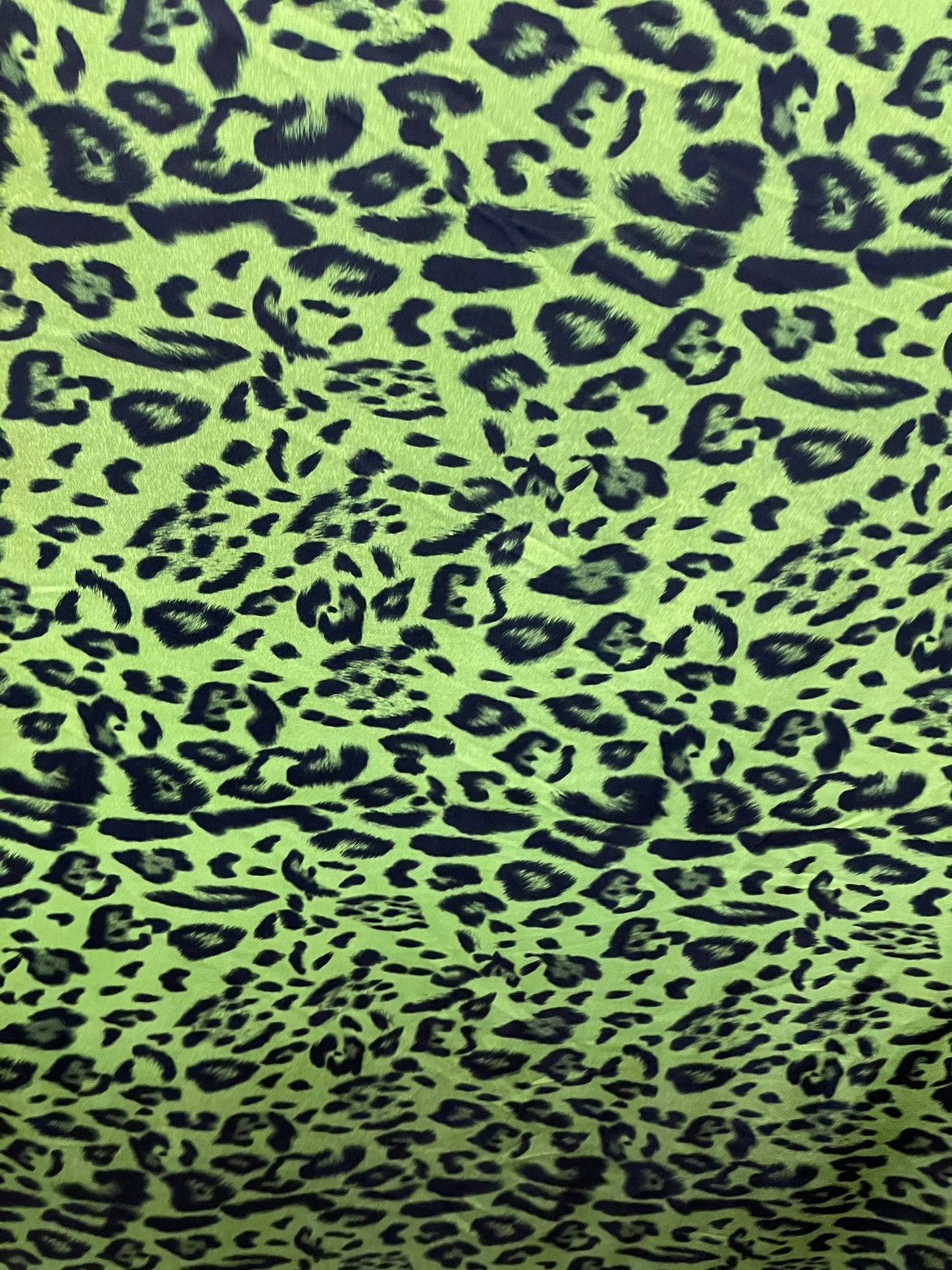 Exotic leopard design print on nylon spandex 4-way stretch Green /black 58/60” Sold by the YD. Ships Worldwide from Los Angeles California