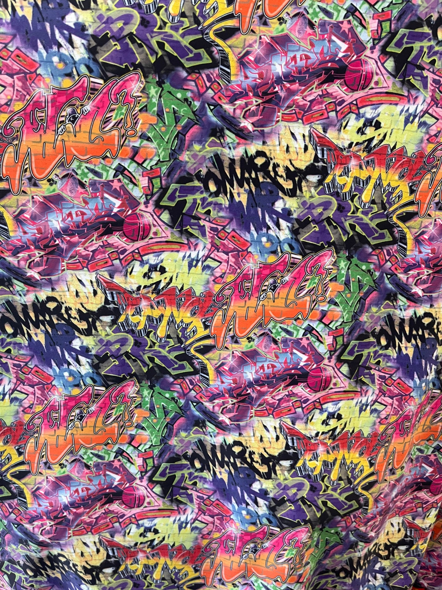 Graffiti design print on best quality of nylon spandex 4-way stretch 58/60” Sold by the YD. Ships Worldwide from Los Angeles California USA.