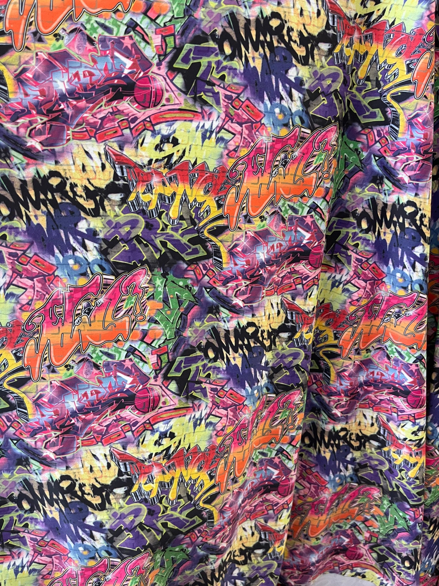 Graffiti design print on best quality of nylon spandex 4-way stretch 58/60” Sold by the YD. Ships Worldwide from Los Angeles California USA.