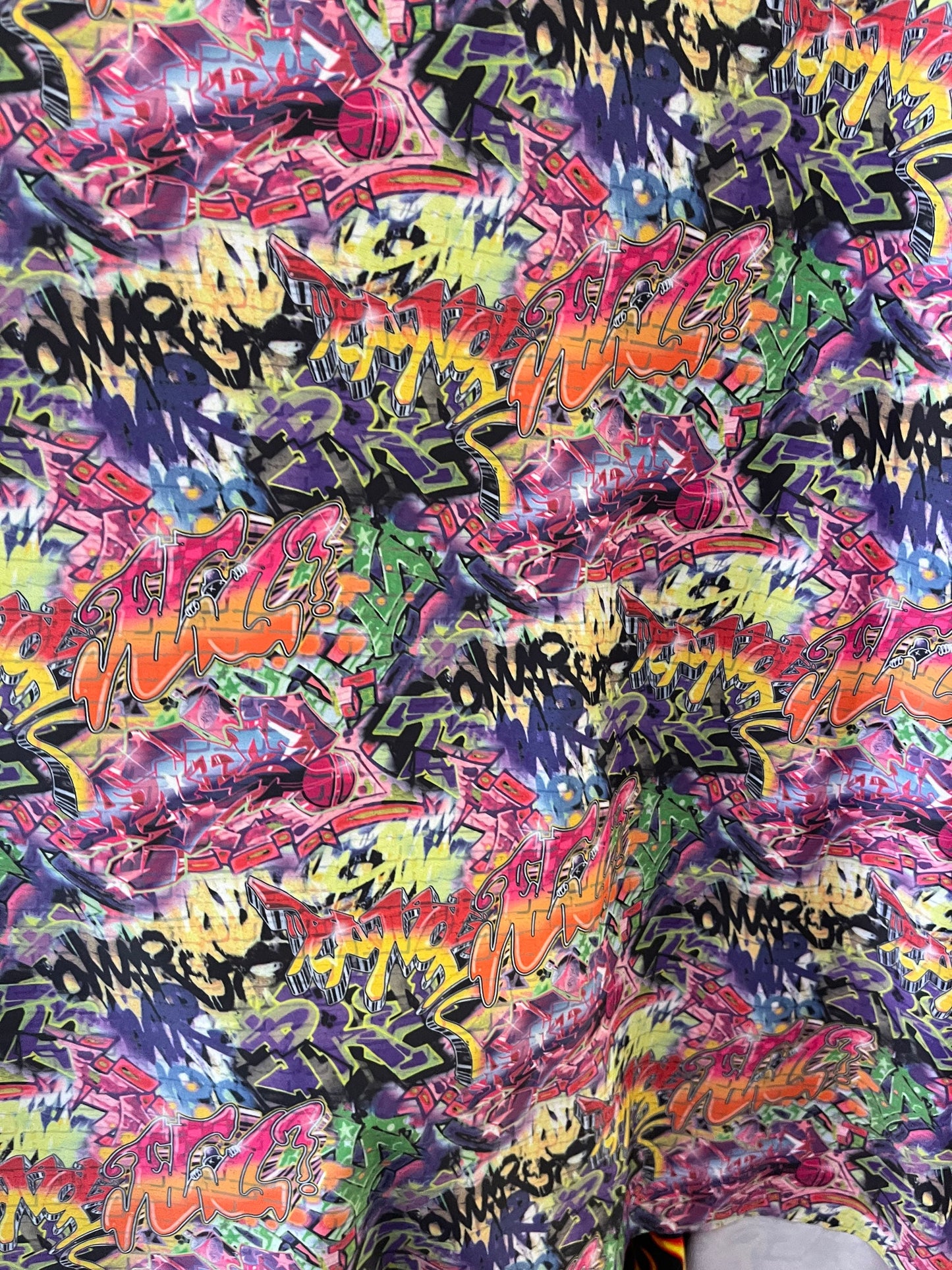 Graffiti design print on best quality of nylon spandex 4-way stretch 58/60” Sold by the YD. Ships Worldwide from Los Angeles California USA.