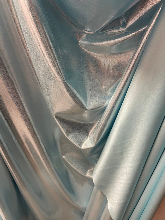 Lt blue metallic nylon spandex with foggy foil 4-way stretch 58/60” Sold by the YD. Ships Worldwide from Los Angeles California USA