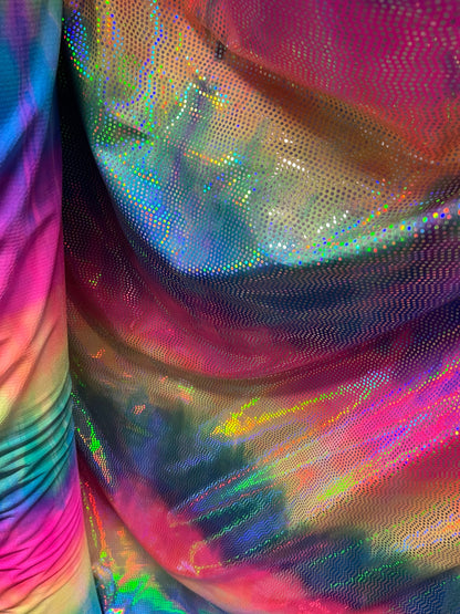 Iridescent disco design mini hologram sequins on tie dye nylon spandex 4-way stretch 58/60” Sold by the YD. Ships Worldwide from Los Ángeles