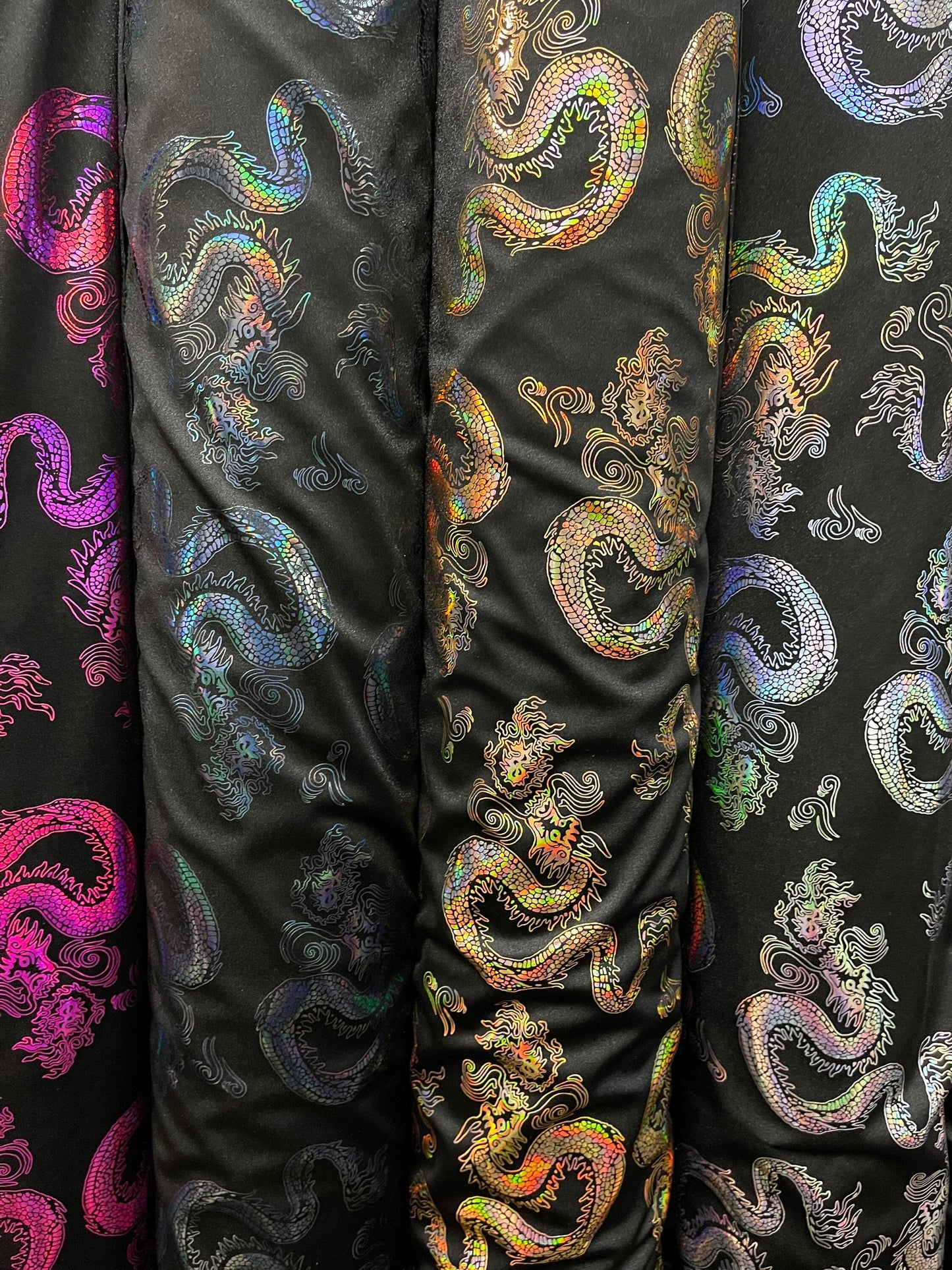 Dragón design hologram nylon spandex 4-way stretch 58/60” Sold by the YD. Ships Worldwide from Los Angeles California USA.