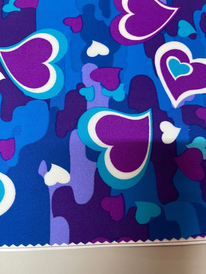 New camouflage with hearts design magenta multicolor print on best quality of nylon spandex 4-way stretch 58/60” Sold by the YD.