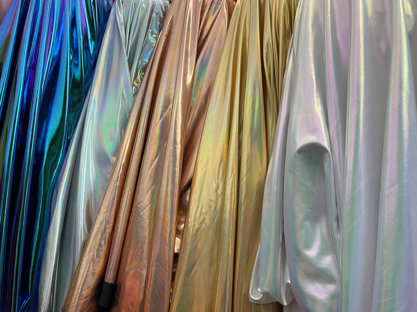 All over foil iridescent super shiny metallic poly spandex 4-way stretch 58/60” Sold by the YD. Ships Worldwide from Los Angeles California