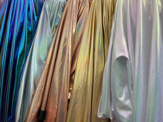 All over foil iridescent super shiny metallic poly spandex 4-way stretch 58/60” Sold by the YD. Ships Worldwide from Los Angeles California