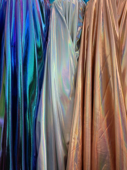 All over foil iridescent super shiny metallic poly spandex 4-way stretch 58/60” Sold by the YD. Ships Worldwide from Los Angeles California