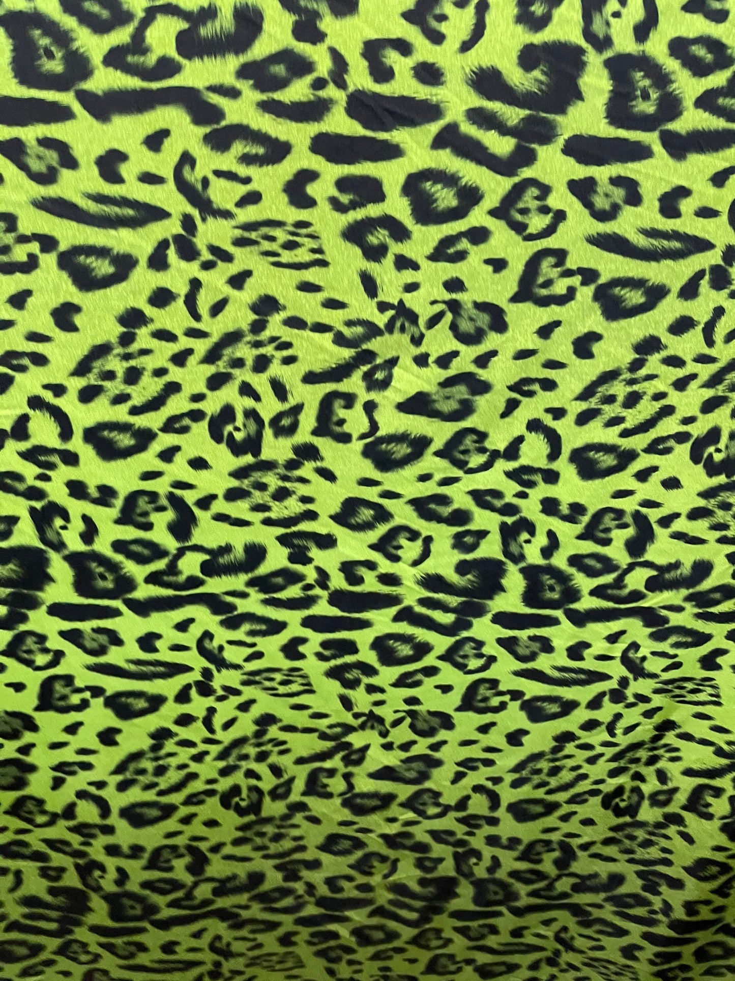 Exotic leopard design print on nylon spandex 4-way stretch Green /black 58/60” Sold by the YD. Ships Worldwide from Los Angeles California