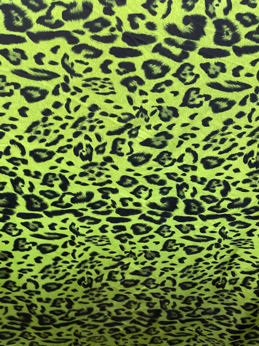 Exotic leopard design print on nylon spandex 4-way stretch Green /black 58/60” Sold by the YD. Ships Worldwide from Los Angeles California