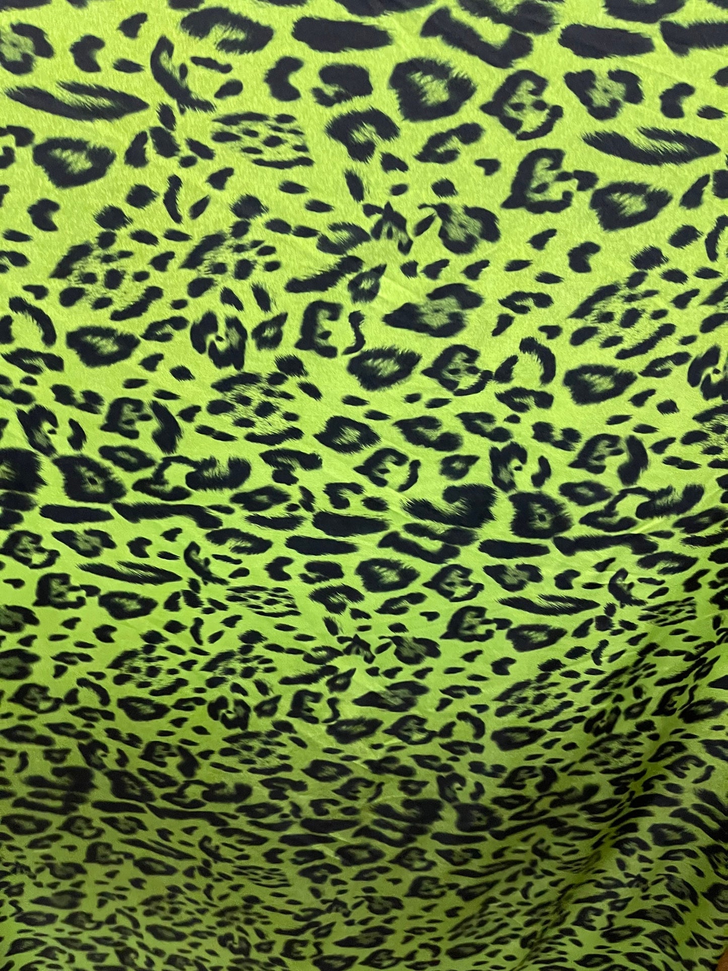 Exotic leopard design print on nylon spandex 4-way stretch Green /black 58/60” Sold by the YD. Ships Worldwide from Los Angeles California