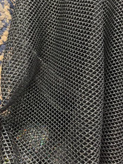 Metallic fishnet Black/Silver 2-way stretch 58/60” Sold by the YD. Ships Worldwide from Los Angeles California USA.