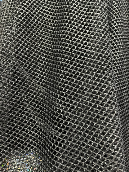 Metallic fishnet Black/Silver 2-way stretch 58/60” Sold by the YD. Ships Worldwide from Los Angeles California USA.