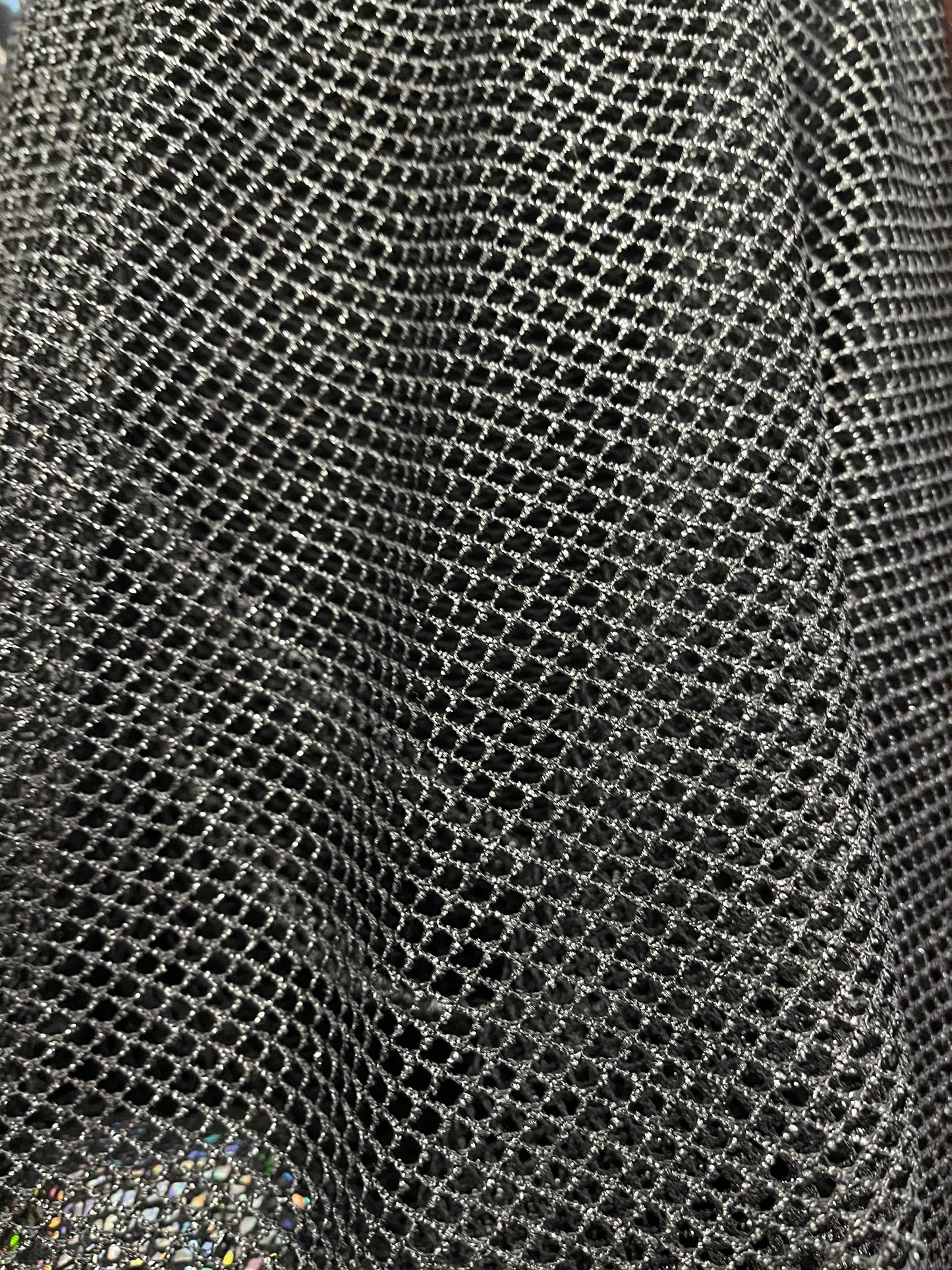 Metallic fishnet Black/Silver 2-way stretch 58/60” Sold by the YD. Ships Worldwide from Los Angeles California USA.