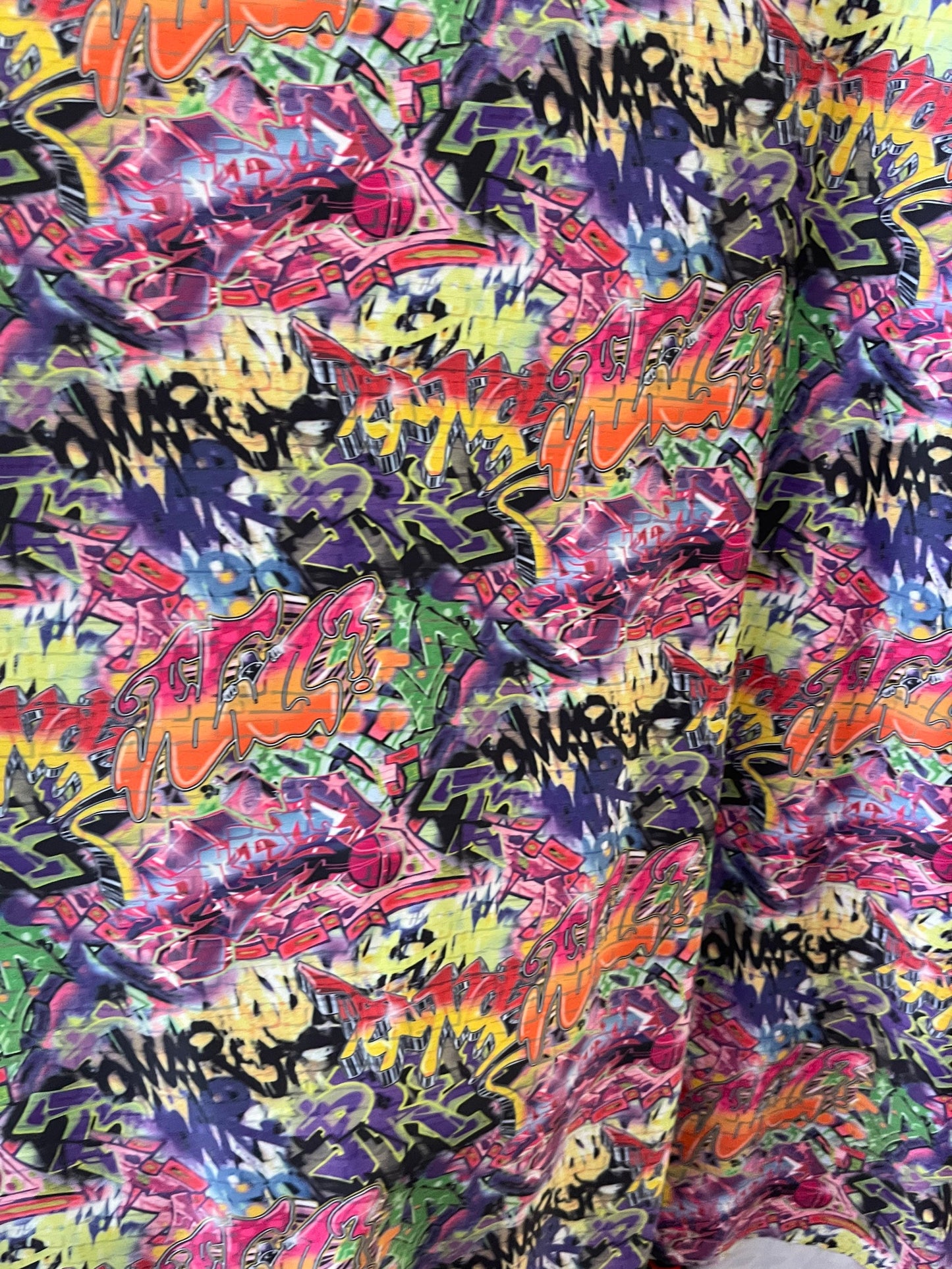 Graffiti design print on best quality of nylon spandex 4-way stretch 58/60” Sold by the YD. Ships Worldwide from Los Angeles California USA.