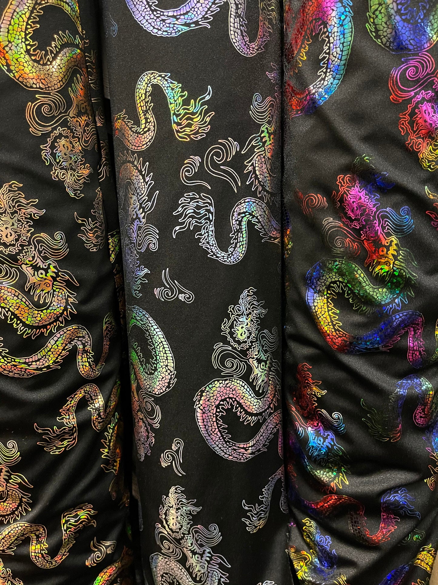 Dragón design hologram nylon spandex 4-way stretch 58/60” Sold by the YD. Ships Worldwide from Los Angeles California USA.