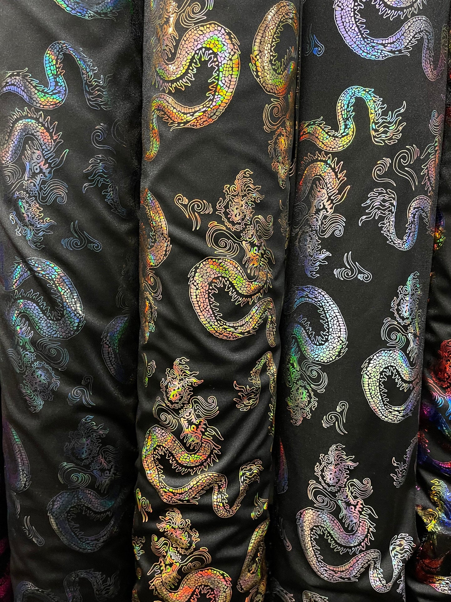 Dragón design hologram nylon spandex 4-way stretch 58/60” Sold by the YD. Ships Worldwide from Los Angeles California USA.