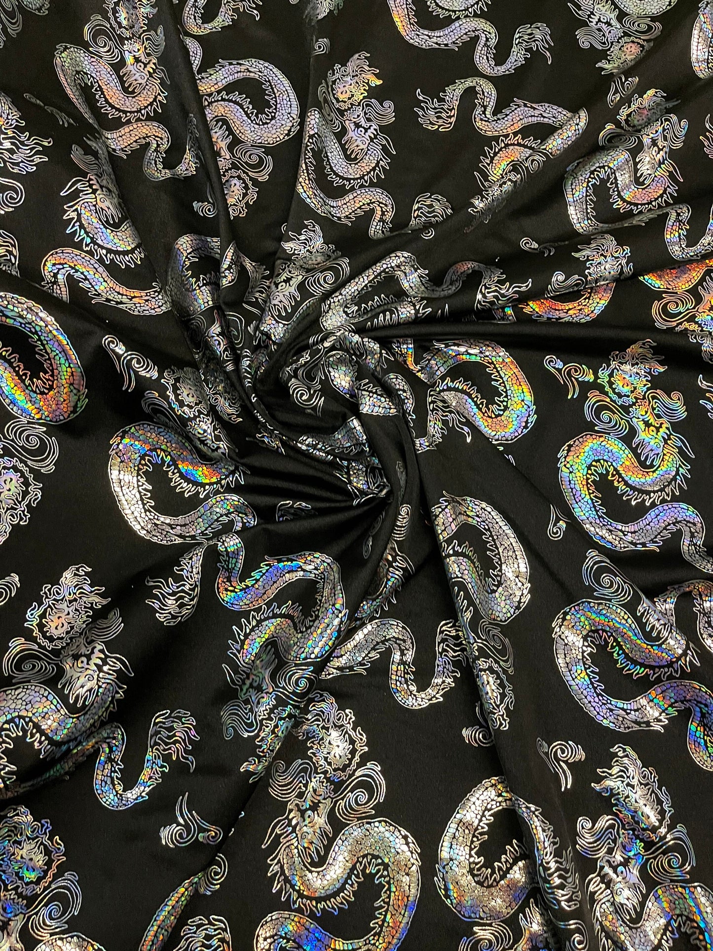 New Dragon design print on metallic nylon spandex 4-way stretch 58/60” Sold by the YD. Ships worldwide from Los Ángeles California USA.