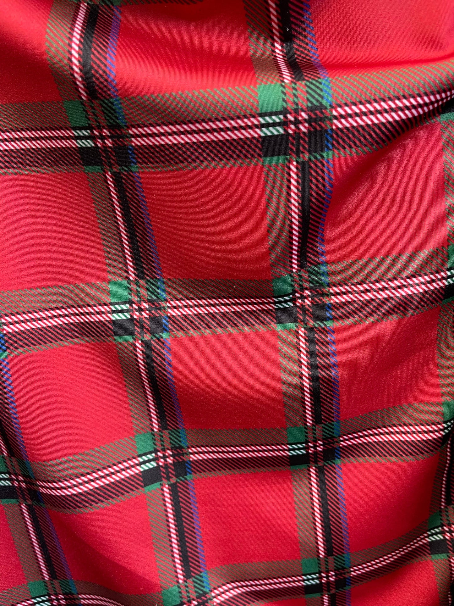 Red plaid modern design print on great quality of nylon spandex 4-way stretch 58/60” Sold by the YD. Ships Worldwide from Los Angeles cali.