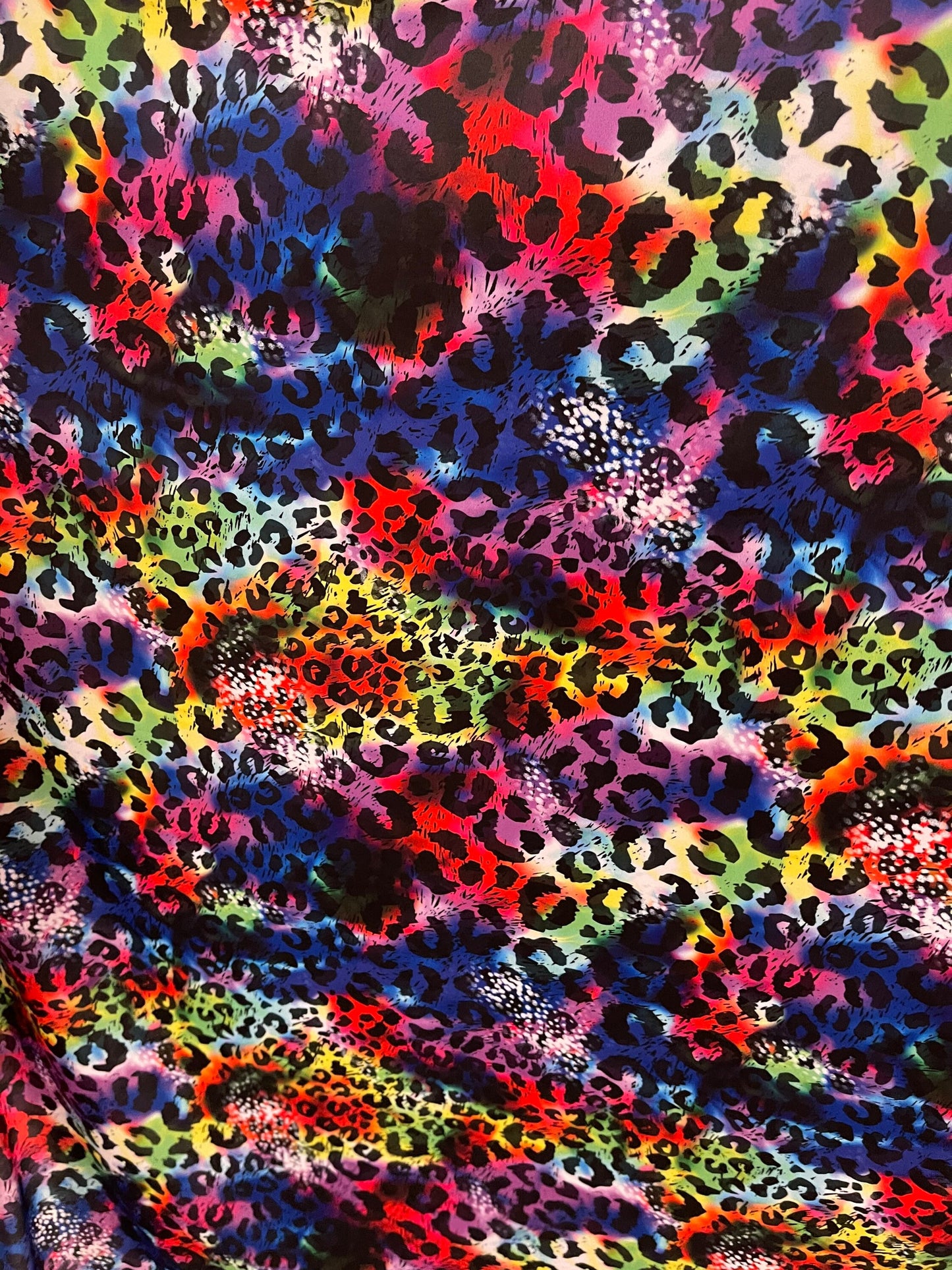 New Leopard design print on Tie Dye nylon spandex 4-way stretch 58/60” Sold by the YD. Ships Worldwide from Los Angeles California USA.