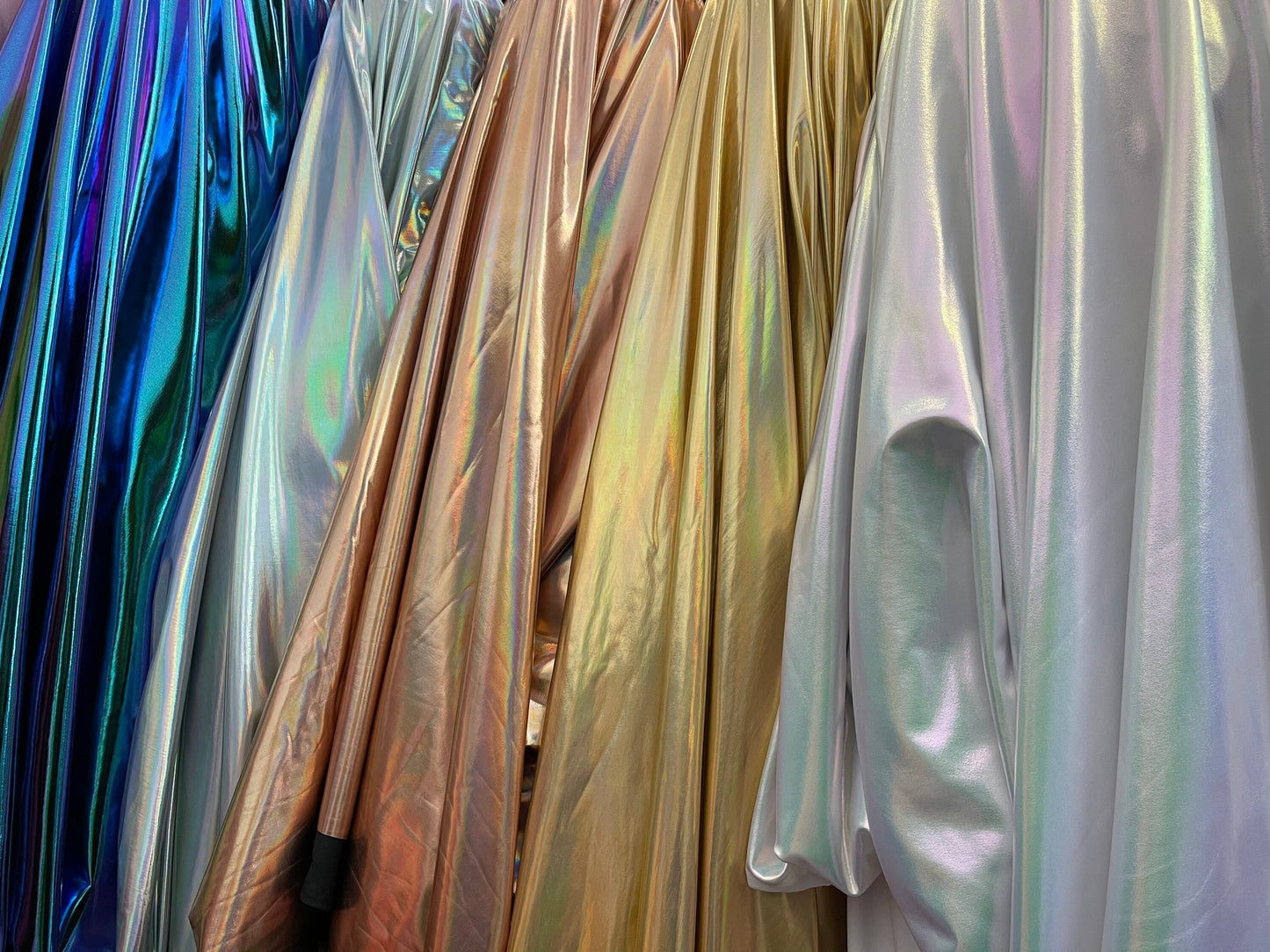 All over foil iridescent super shiny metallic poly spandex 4-way stretch 58/60” Sold by the YD. Ships Worldwide from Los Angeles California