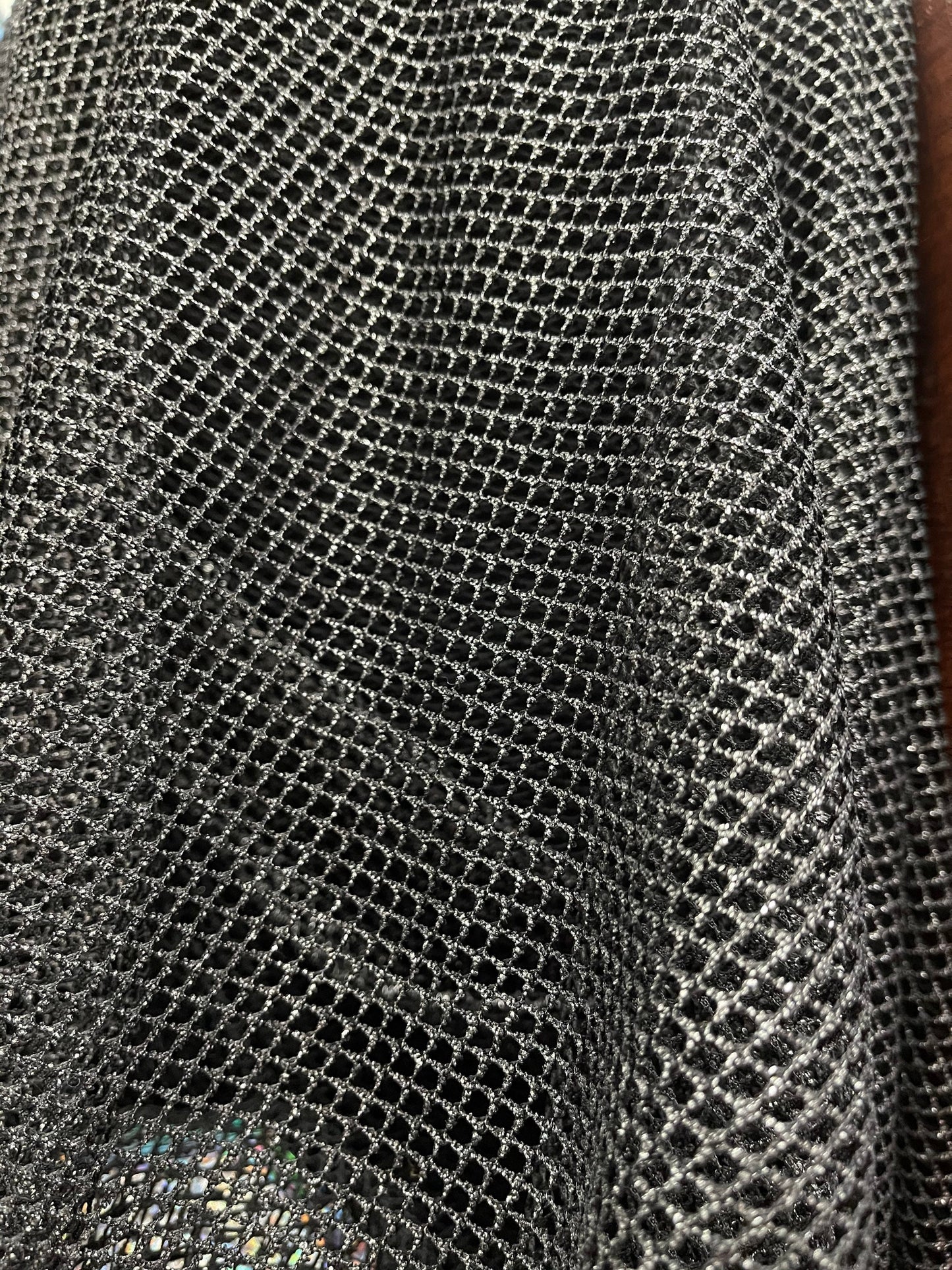 Metallic fishnet Black/Silver 2-way stretch 58/60” Sold by the YD. Ships Worldwide from Los Angeles California USA.