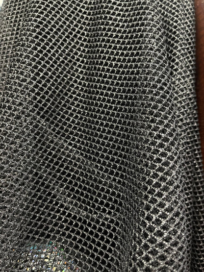 Metallic fishnet Black/Silver 2-way stretch 58/60” Sold by the YD. Ships Worldwide from Los Angeles California USA.