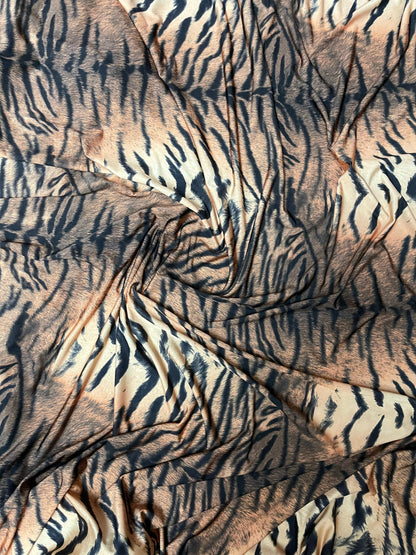 Tiger design exotic animal print on poly spandex medium weight 4-way stretch 58/60” Sold by the YD. Ships Worldwide from Los Angeles CA