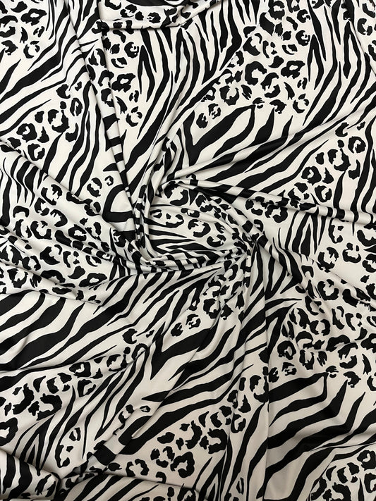 Exotic animal print white/black print on nylon spandex 4-way stretch 58/60” Sold by the YD. Ships Worldwide from Los Angeles California USA.