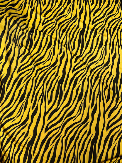 Exotic zebra design yellow/black print on nylon spandex 4-way stretch 58/60” Sold by the YD. Ships Worldwide from Los Angeles California USA