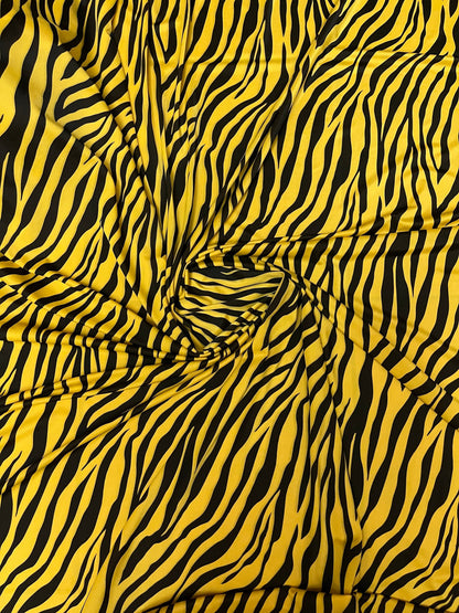 Exotic zebra design yellow/black print on nylon spandex 4-way stretch 58/60” Sold by the YD. Ships Worldwide from Los Angeles California USA