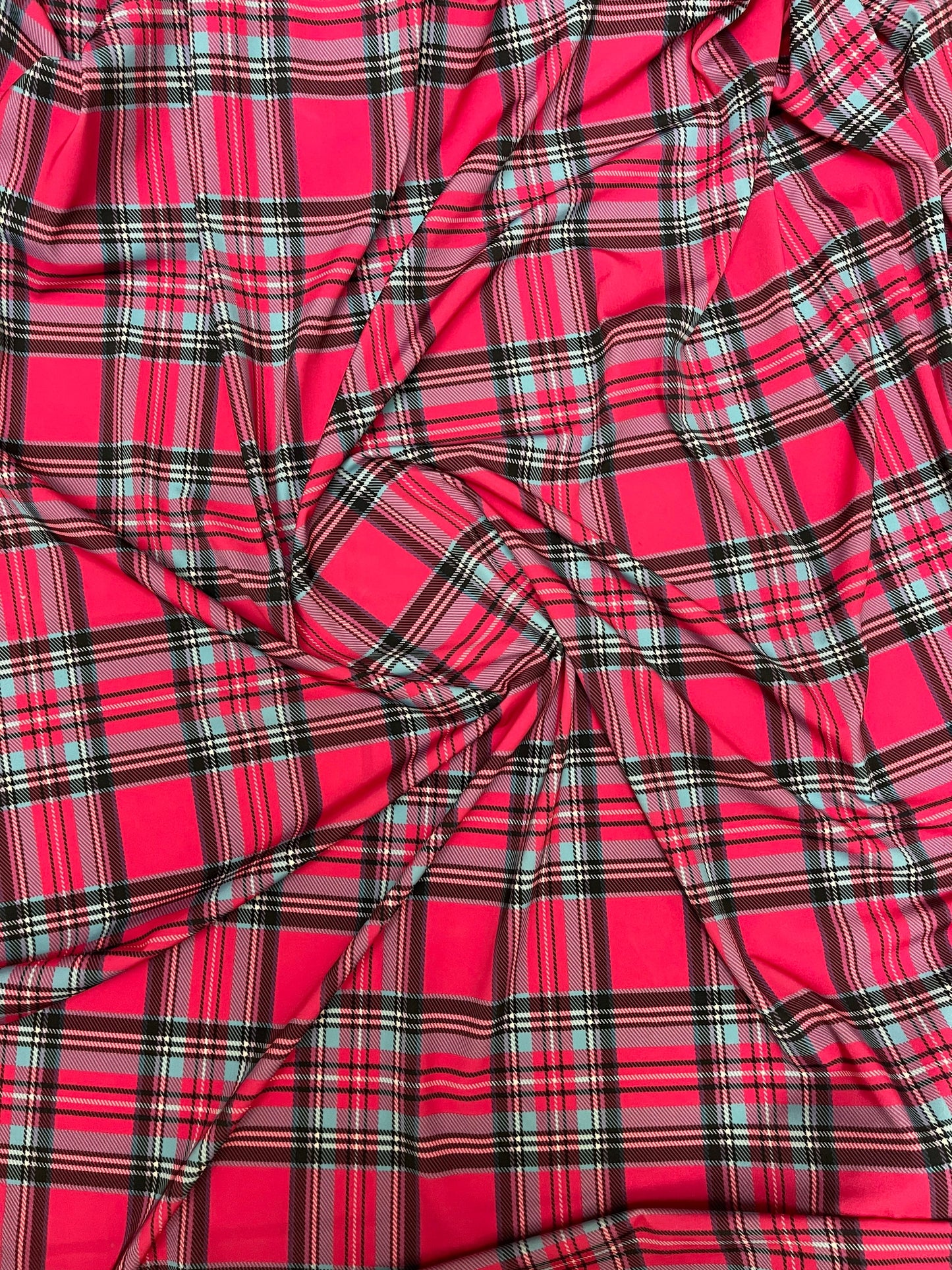 Plaid modern design hot pink multicolor print on great quality of nylon spandex 4-way stretch 58/60” Sold by the YD.