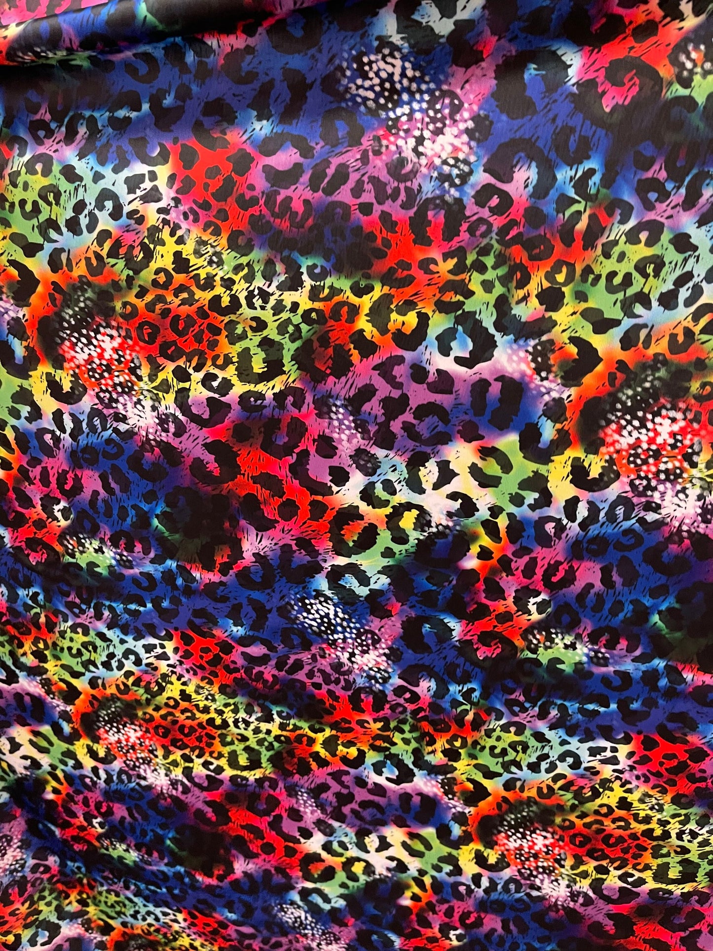 New Leopard design print on Tie Dye nylon spandex 4-way stretch 58/60” Sold by the YD. Ships Worldwide from Los Angeles California USA.