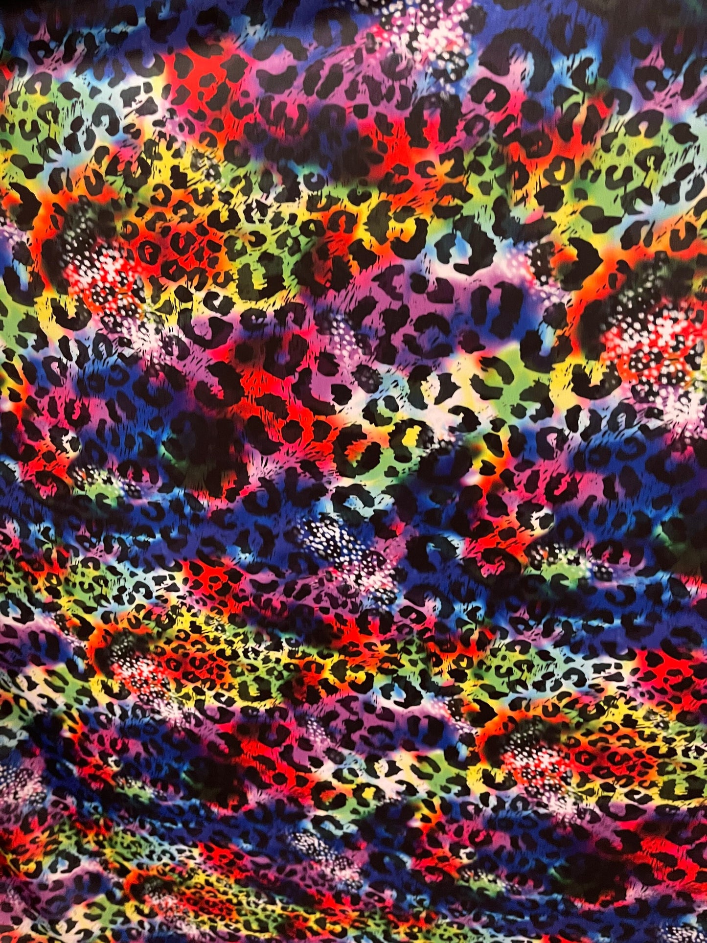 New Leopard design print on Tie Dye nylon spandex 4-way stretch 58/60” Sold by the YD. Ships Worldwide from Los Angeles California USA.