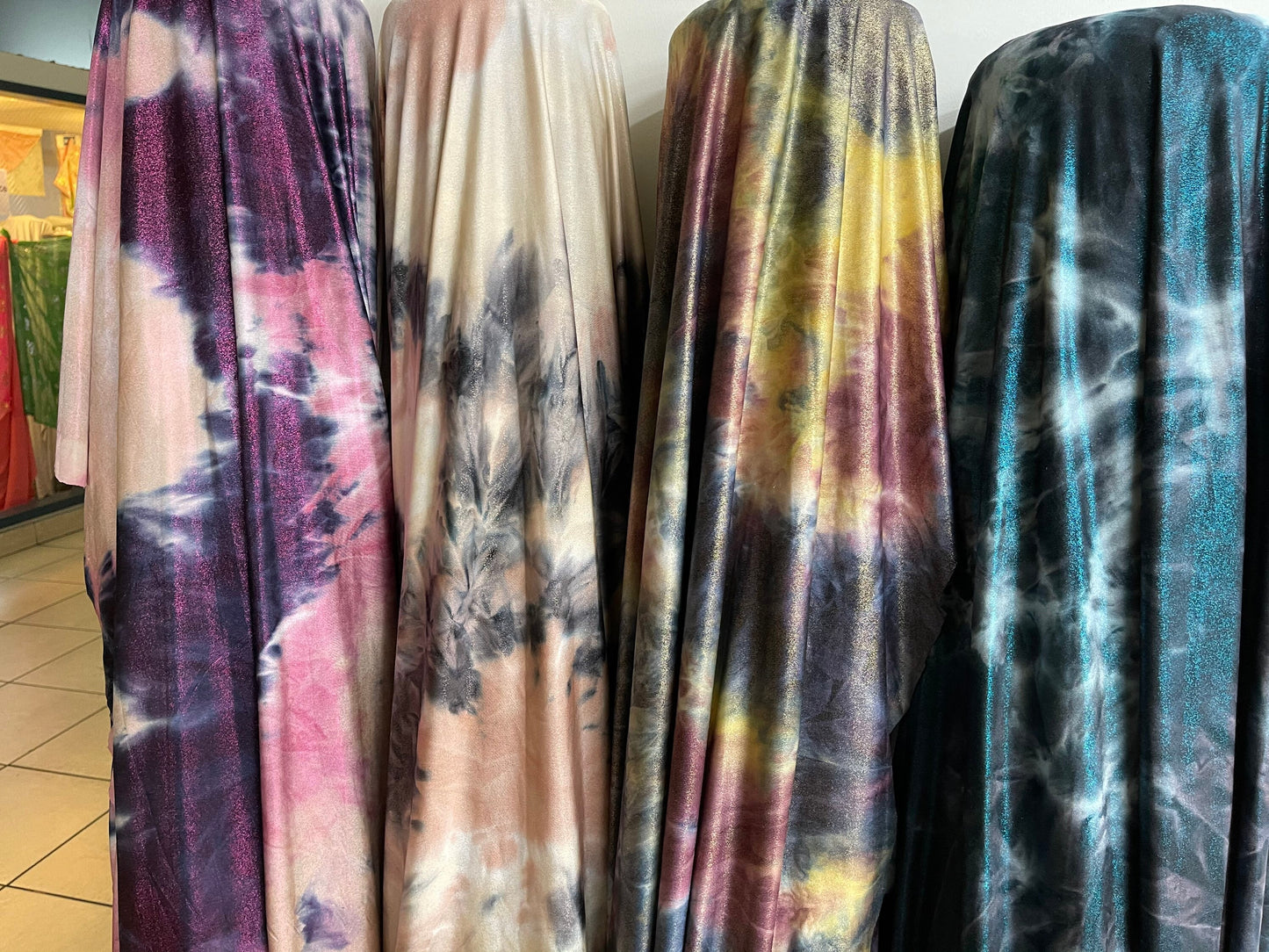 Tie dye design with foggy foil print on poly brushed spandex 2-way stretch 58/60” light weight 58/60” Sold by the YD. Ships  Worldwide