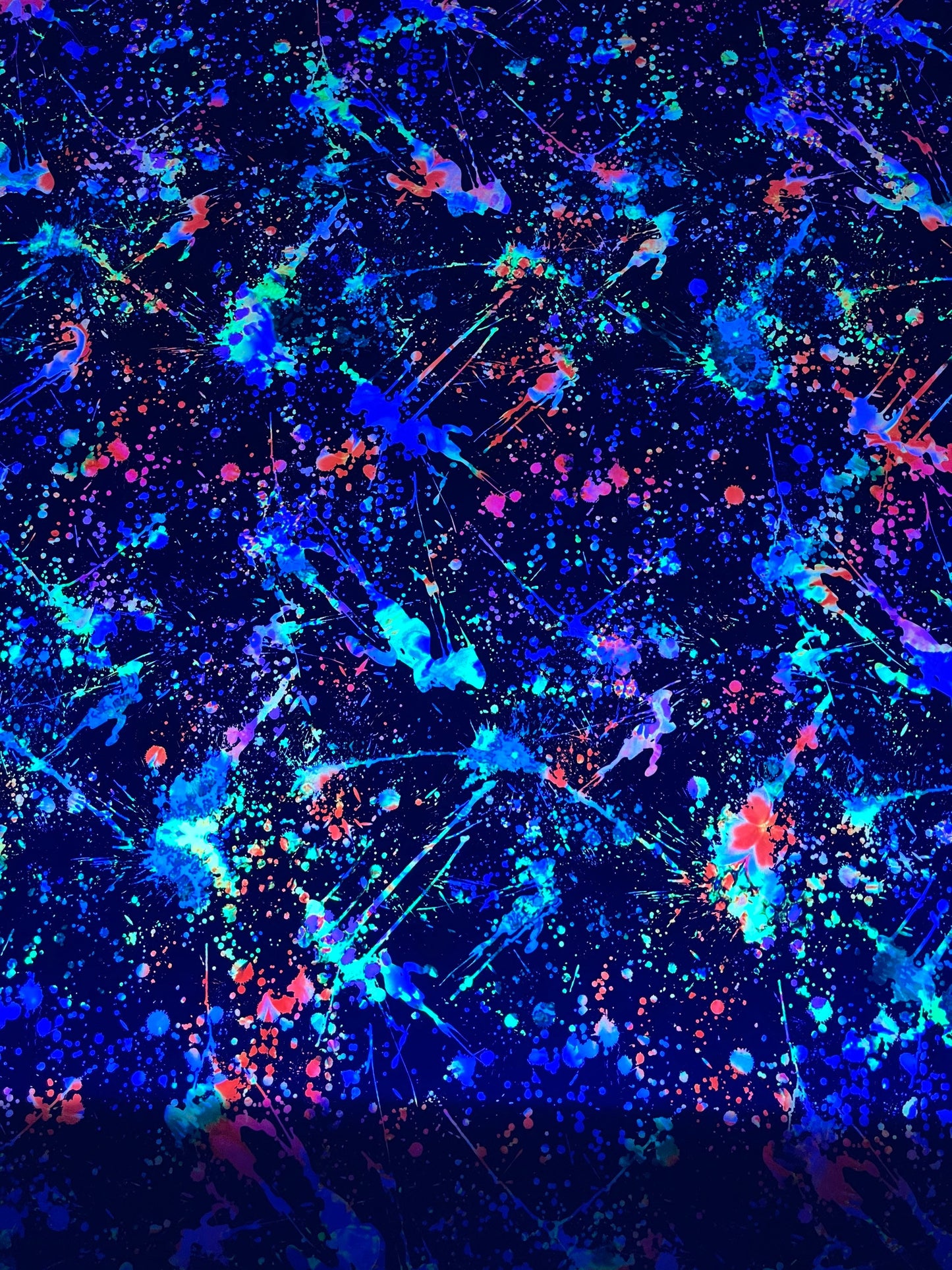 New splatter paint design Black/Multicolor print on nylon spandex 4-way stretch 58/60” Sold by the YD. It glow in the dark with Black Light