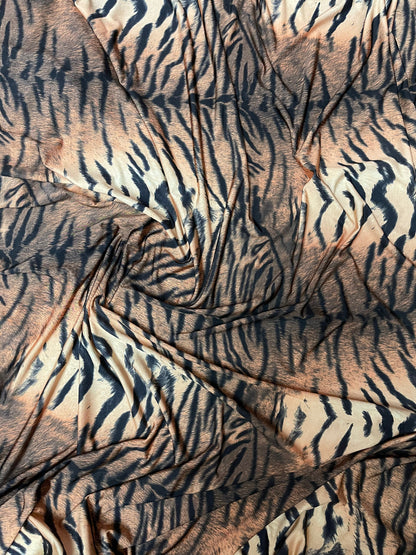 Tiger design exotic animal print on poly spandex medium weight 4-way stretch 58/60” Sold by the YD. Ships Worldwide from Los Angeles CA