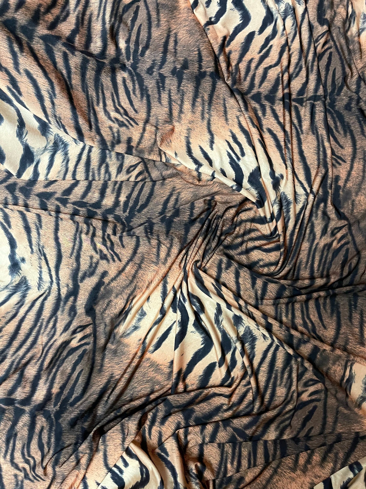 Tiger design exotic animal print on poly spandex medium weight 4-way stretch 58/60” Sold by the YD. Ships Worldwide from Los Angeles CA