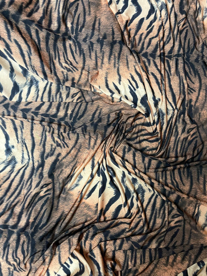 Tiger design exotic animal print on poly spandex medium weight 4-way stretch 58/60” Sold by the YD. Ships Worldwide from Los Angeles CA