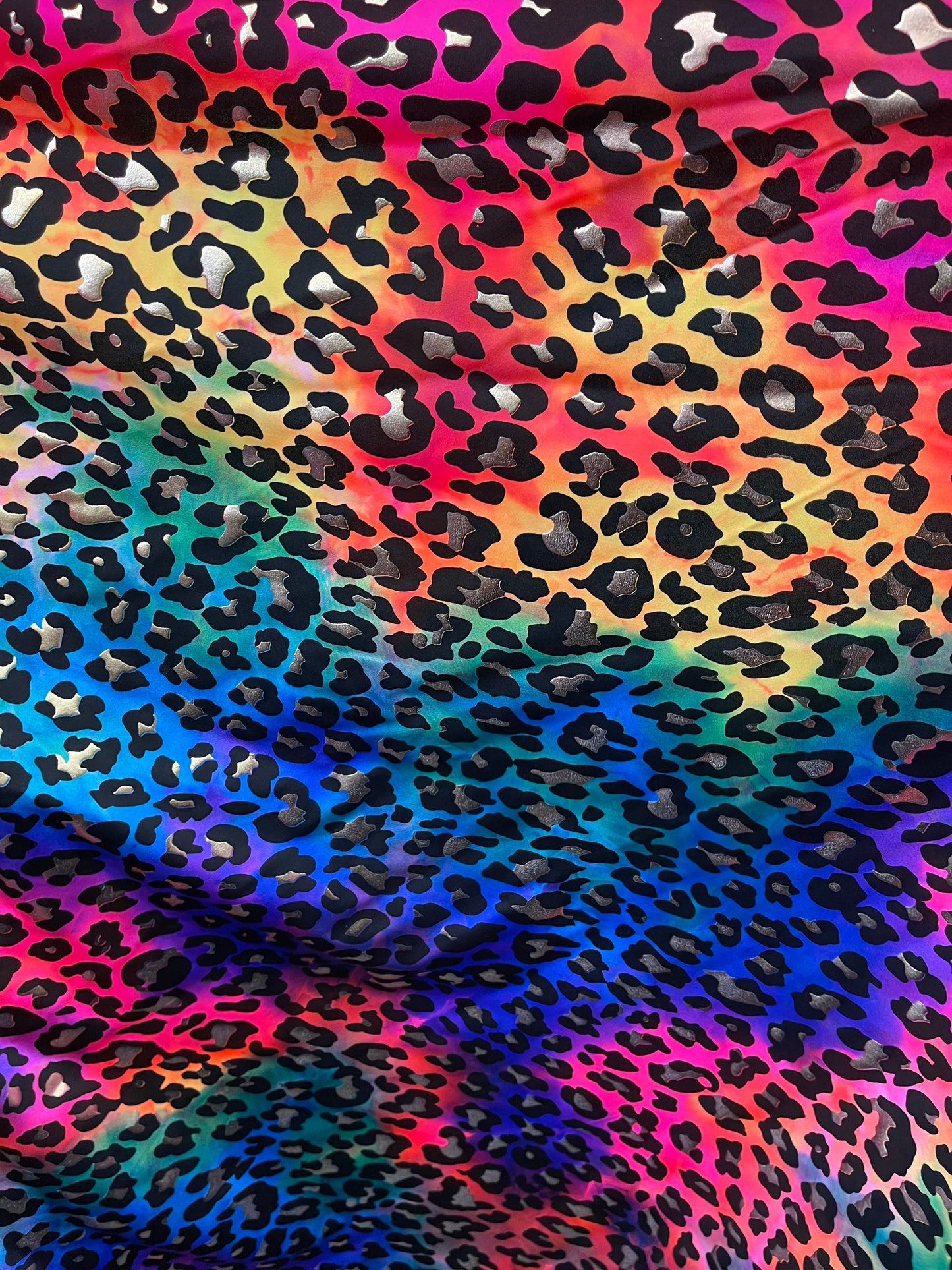 Metallic Leopard design print on Tie Dye spandex 4-way stretch 58/60” Sold by the YD. Ships Worldwide from Los Angeles California USA.