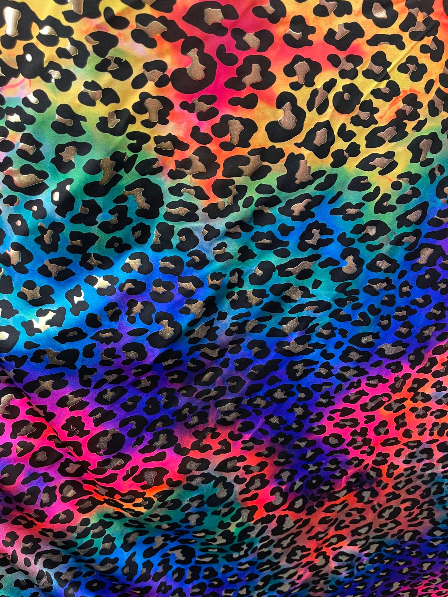 Metallic Leopard design print on Tie Dye spandex 4-way stretch 58/60” Sold by the YD. Ships Worldwide from Los Angeles California USA.