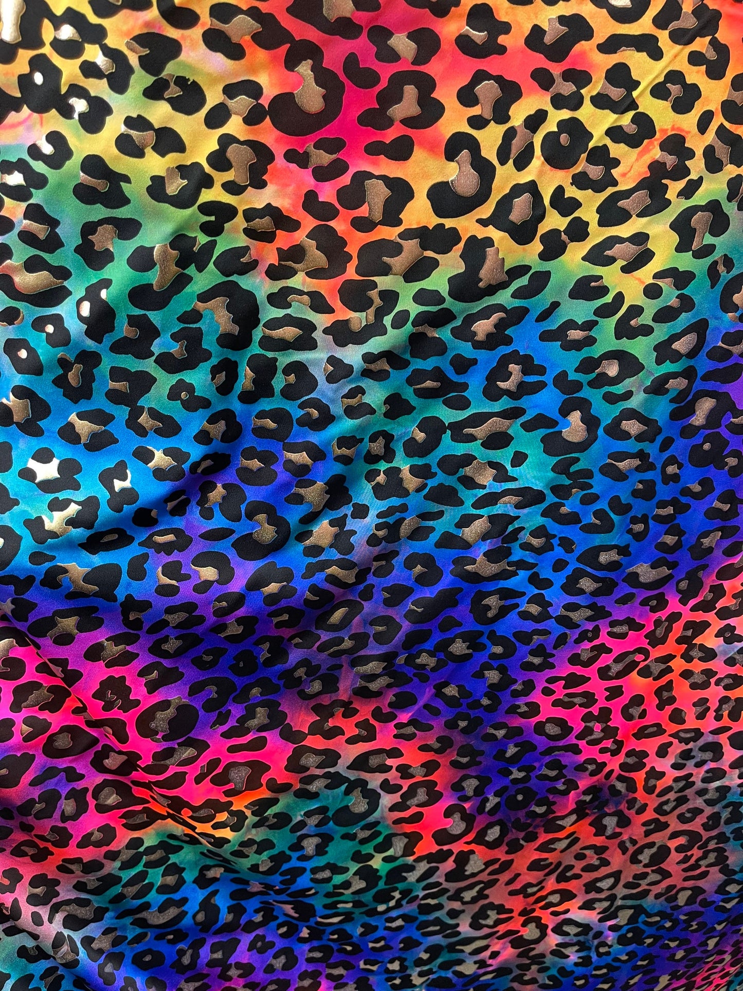 Metallic Leopard design print on Tie Dye spandex 4-way stretch 58/60” Sold by the YD. Ships Worldwide from Los Angeles California USA.