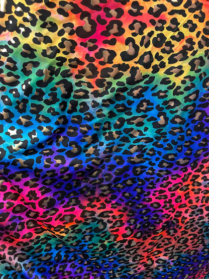 Metallic Leopard design print on Tie Dye spandex 4-way stretch 58/60” Sold by the YD. Ships Worldwide from Los Angeles California USA.