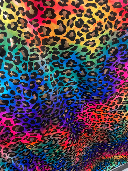 Metallic Leopard design print on Tie Dye spandex 4-way stretch 58/60” Sold by the YD. Ships Worldwide from Los Angeles California USA.