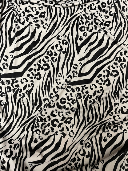 Exotic animal print white/black print on nylon spandex 4-way stretch 58/60” Sold by the YD. Ships Worldwide from Los Angeles California USA.