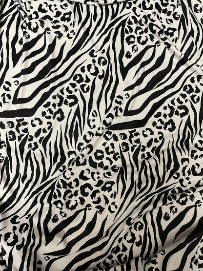 Exotic animal print white/black print on nylon spandex 4-way stretch 58/60” Sold by the YD. Ships Worldwide from Los Angeles California USA.