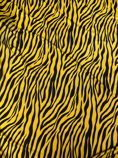 Exotic zebra design yellow/black print on nylon spandex 4-way stretch 58/60” Sold by the YD. Ships Worldwide from Los Angeles California USA